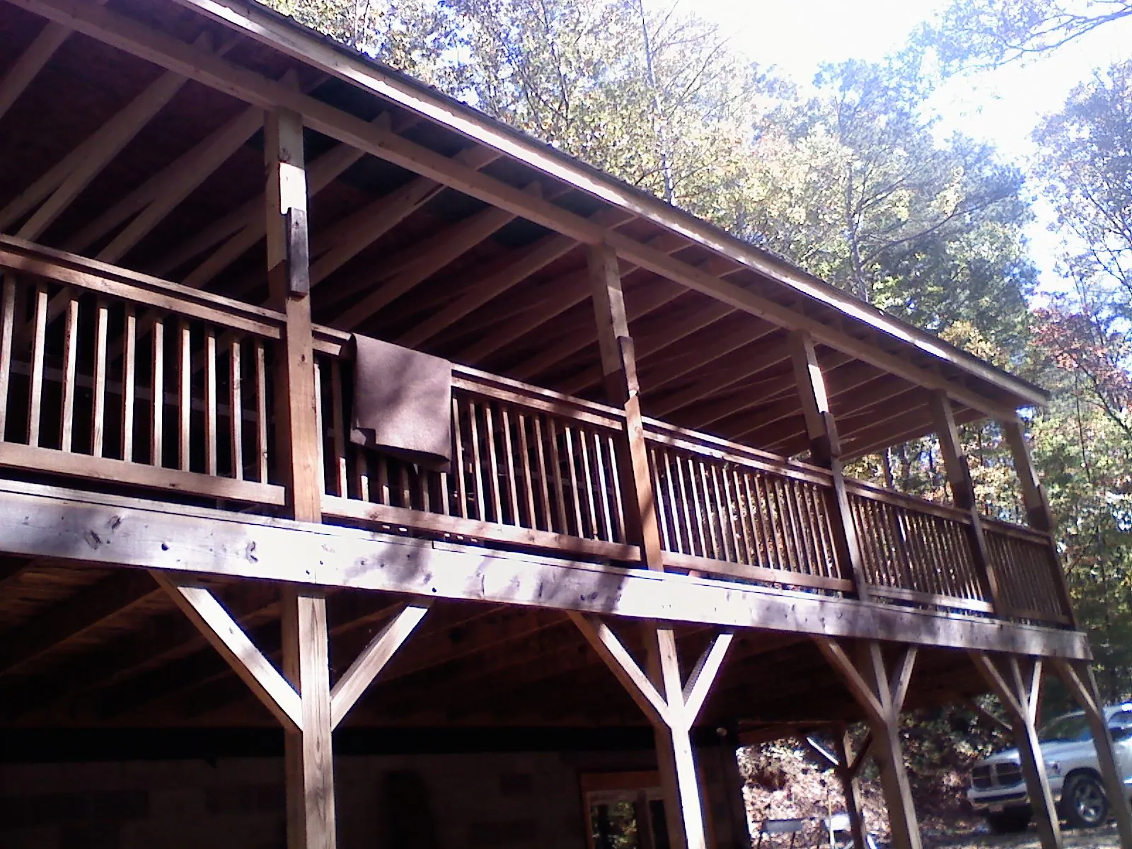 Timber framing under a new elevated porch and deck — Roof Leak Repair in Prairie Village by Roofing Brothers